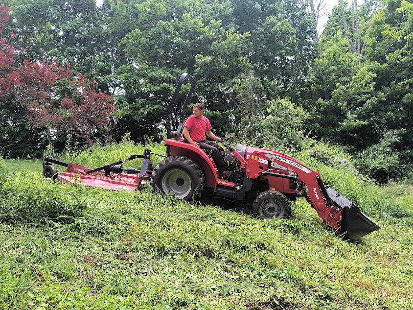 A man on a tractor.