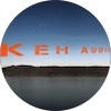 Circular image showing a partial view of a sky and landscape. The text "KEH AUDIO" is partially visible in red across the top.